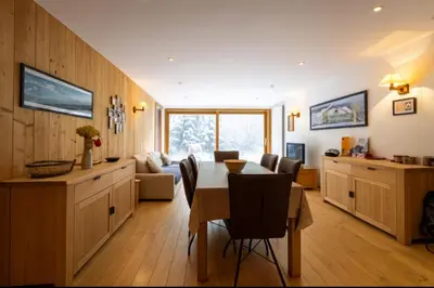 a kitchen and dining room with a table and chairs at Bright apartment - near Mont Blanc in Chamonix-Mont-Blanc