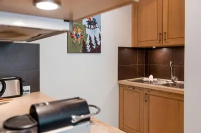 a kitchen with a sink and a counter top at Bright apartment - near Mont Blanc in Chamonix-Mont-Blanc