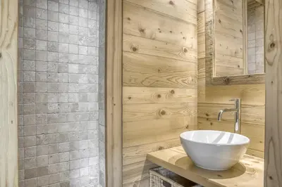 a bathroom with a white sink and a shower at Harmonie in Demi-Quartier