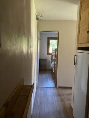 a hallway of a house with a wooden floor at Marmotton in Megève