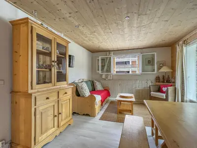 a living room with a couch and a table at ARA15 Appartement 6 Pers centre station Carroz in Les Carroz d'Araches