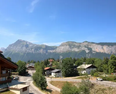 a view of a town with mountains in the background at SC316 - Duplex 8 Pers centre des Carroz in Les Carroz d'Araches