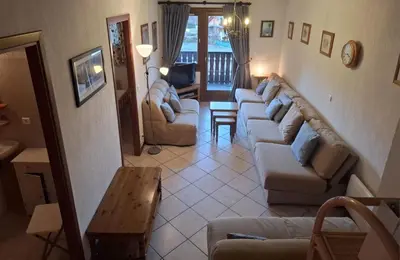 a living room with couches and a table at SC316 - Duplex 8 Pers centre des Carroz in Les Carroz d'Araches