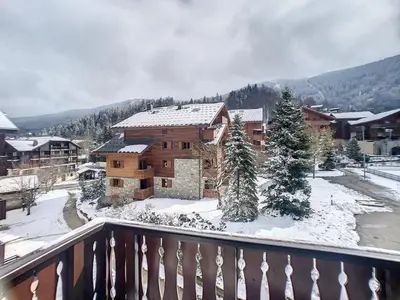 a view of a house with snow on the ground at SC316 - Duplex 8 Pers centre des Carroz in Les Carroz d'Araches