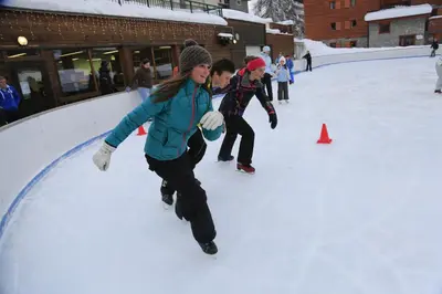 a group of people playing in the snow at AT101 Appartement 6 Pers proche base de loisirs in Les Carroz d'Araches