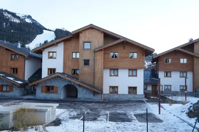 a group of buildings with snow on the ground at CAL02 - Studio 4 Pers centre des Carroz in Les Carroz d'Araches