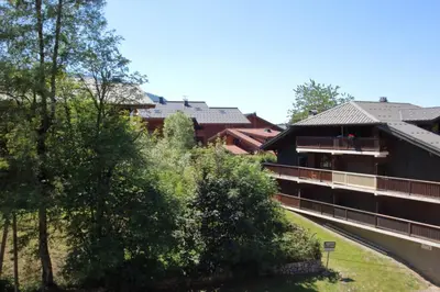 a view of a building with trees at AM104 Duplex 8 Pers centre des Carroz in Les Carroz d'Araches