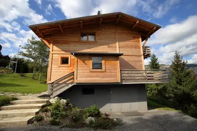 a house with a roof on top of it at CH719 - Chalet 10 Pers aux Carroz in Les Carroz d'Araches