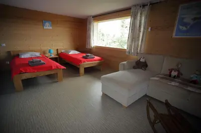 a living room with a couch and a table at CH719 - Chalet 10 Pers aux Carroz in Les Carroz d'Araches