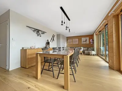 a kitchen and dining room with a table and chairs at GCB103 Appartement 10 personnes in Les Carroz d'Araches