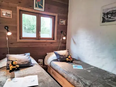 a town on a hill with mountains in the background at Apartment Chalet du Rosay by Interhome in Saint-Gervais-les-Bains