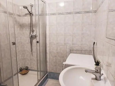 a bathroom with a shower and a sink and a toilet at Apartment Conseil-9 by Interhome in Saint-Gervais-les-Bains