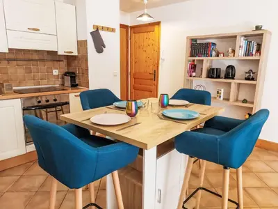a living room with a table and chairs and a couch at Apartment Conseil-9 by Interhome in Saint-Gervais-les-Bains