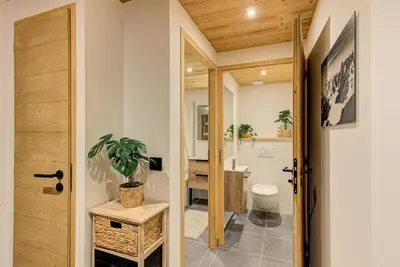 a bathroom with a toilet and a sink at Apartment des Alpages - Alpes Travel - Sleeps 6-8 in Les Trabets