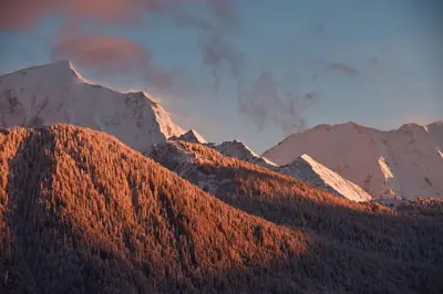 a group of mountains with smoke coming out of them at Maison de montagne in Passy