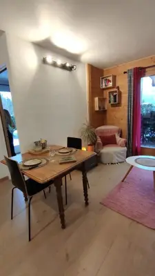 a bedroom with a bed with a pillow on it at Petit cocon proche Saint Gervais in Saint-Gervais-les-Bains