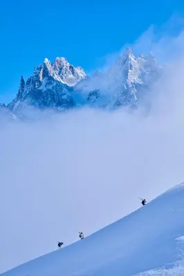a snow covered mountain in the distance with snow at Chalet Choucas - Modern Luxury - Heart of Chamonix in Chamonix-Mont-Blanc