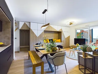 a living room with a dining table and a living room at Panorama MontBlanc in Domancy