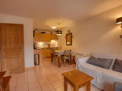 a living room with a couch and a table at Bel appartement skis aux pieds à Morillon 1100 - 4 à 6 personnes - FR-1-642-94 in Morillon