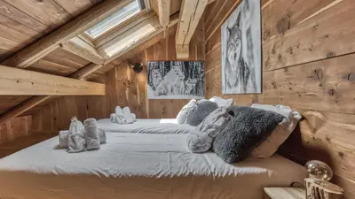 a bedroom with two beds in a attic at Ferme des Moussoux in Chamonix-Mont-Blanc