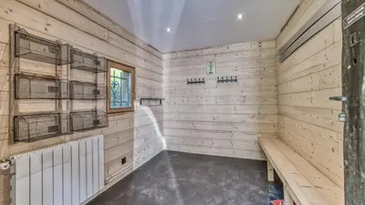a large room with wooden paneled walls at Ferme des Moussoux in Chamonix-Mont-Blanc