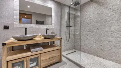 a bathroom with two sinks and a shower at Ferme des Moussoux in Chamonix-Mont-Blanc