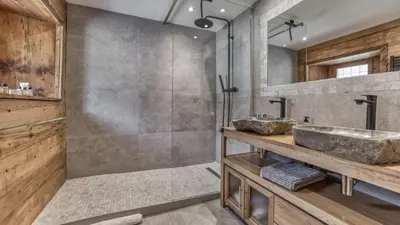 a bathroom with a sink and a shower at Ferme des Moussoux in Chamonix-Mont-Blanc