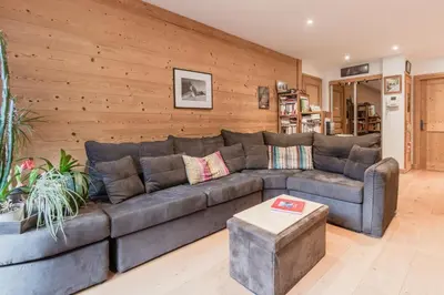 a living room with a couch and a table at Grand Paradis in Chamonix-Mont-Blanc