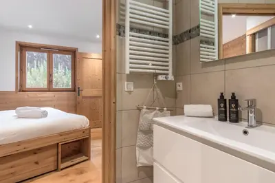 a bathroom with a white sink and a mirror at Grand Paradis in Chamonix-Mont-Blanc