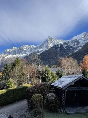 a house with a view of snow covered mountains at La Bastide - Grand chalet privé - Quartier calme in Les Houches
