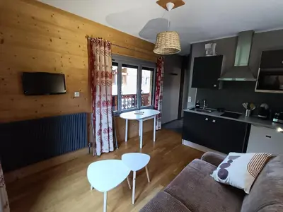 a living room with a couch and a table at La Ferme du Lay in Arâches-la-Frasse