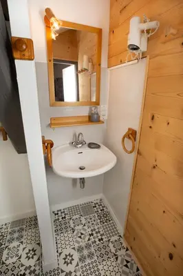 a bathroom with a sink and a mirror at La Ferme du Lay in Arâches-la-Frasse