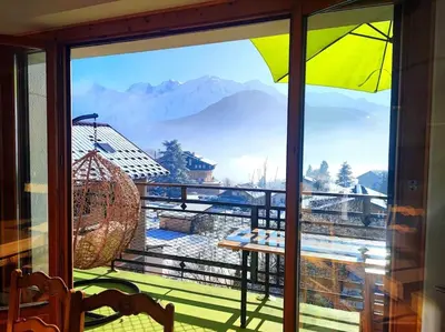 a view from a window with a view of the mountains at Le Chamois d'Assy, résidence alpine de charme in Passy