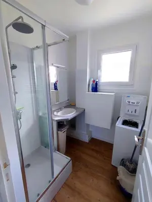 a bathroom with a shower and a sink and a stove at Le Chamois d'Assy, résidence alpine de charme in Passy