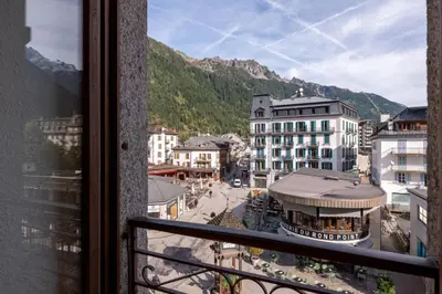 a view from a balcony of a city with buildings at Charming flat right in the city centre in Chamonix-Mont-Blanc