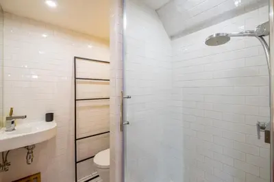 a bathroom with a shower and a toilet and a sink at SmartStay Loft - Exterieur et vue Mont Blanc in Chamonix-Mont-Blanc