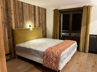 a bedroom with a bed and a window at La Belle Etoile in Saint-Gervais-les-Bains