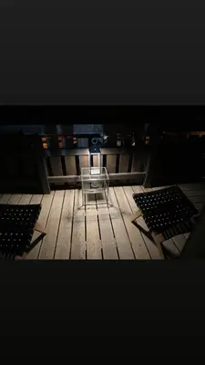 a table sitting on top of a wooden floor at La Belle Etoile in Saint-Gervais-les-Bains