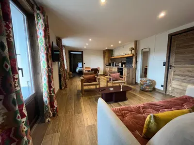 a living room with a couch and a table at La Belle Etoile in Saint-Gervais-les-Bains
