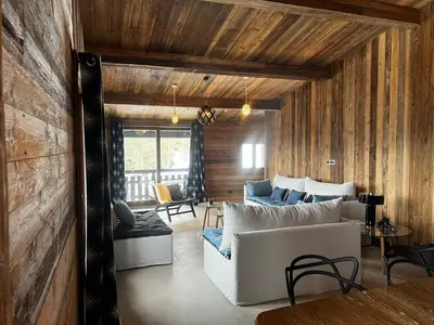a living room with a white couch and a table at La Belle Etoile in Saint-Gervais-les-Bains