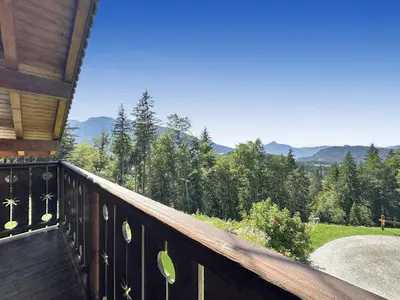 a balcony of a house with a view of the mountains at CH143 - Chalet cosy 6 personnes in Les Carroz d'Araches