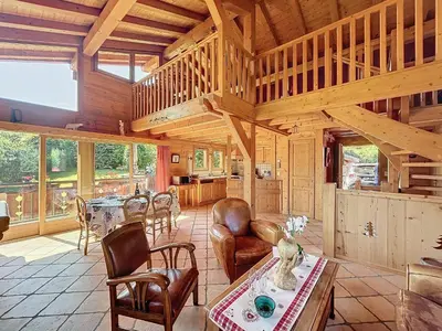 a large living room with a table and chairs at Chalet individuel avec garage, terrasse, buanderie et cuisine équipée - FR-1-560-149 in Sallanches