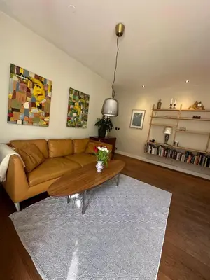 a living room with a couch and a coffee table at 70sqm in heart of chamonix in Chamonix-Mont-Blanc