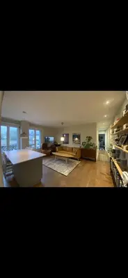 a large living room with a couch and a table at 70sqm in heart of chamonix in Chamonix-Mont-Blanc