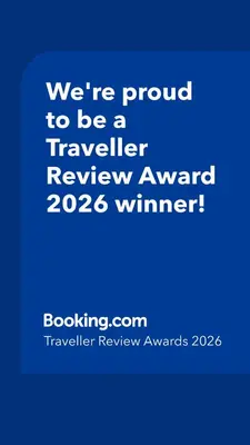 a blue sign that says were proud to be a traveller reviewagency winner at 70sqm in heart of chamonix in Chamonix-Mont-Blanc