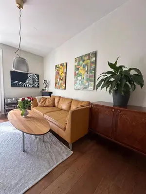 a living room with a couch and a table at 70sqm in heart of chamonix in Chamonix-Mont-Blanc