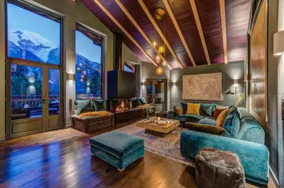 a living room with a couch and a table at Chalet Hibou in Chamonix-Mont-Blanc