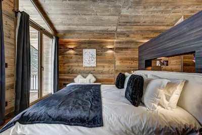 a bathroom with a sink and a toilet and a window at Chalet Freya in Chamonix-Mont-Blanc