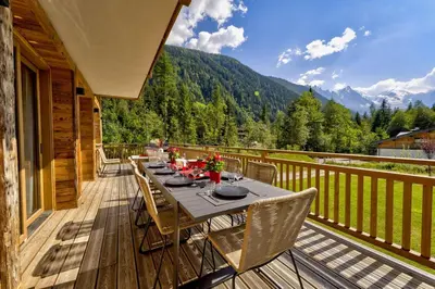 a swimming pool in a house with a wooden ceiling at Chalet Freya in Chamonix-Mont-Blanc