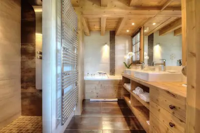 a bathroom with a sink and a mirror at Chalet Nidaya in Les Houches